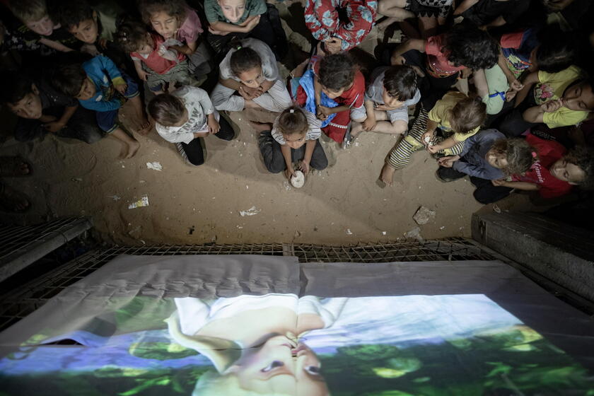 Palestinian man sets up cinema for children at Rafah camp, southern Gaza