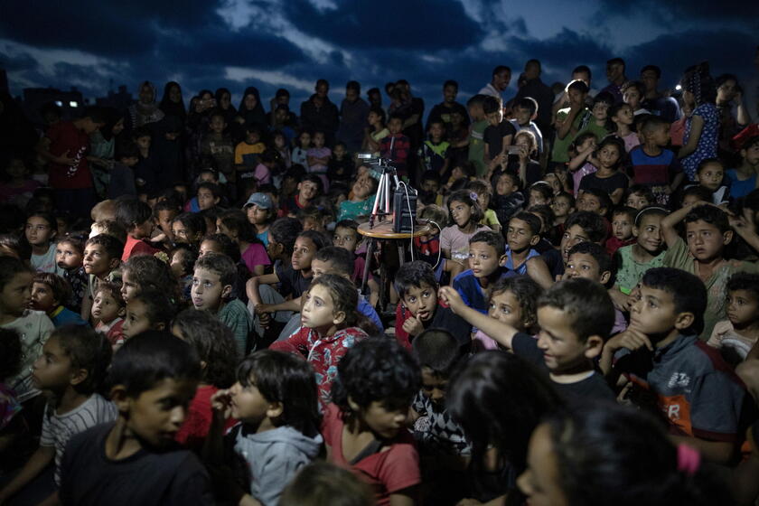 Palestinian man sets up cinema for children at Rafah camp, southern Gaza