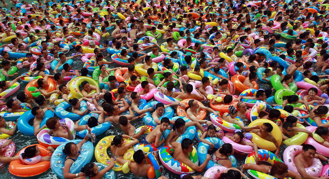 Swimmers wait for the gush of a man-made tide - 2012 © EPA