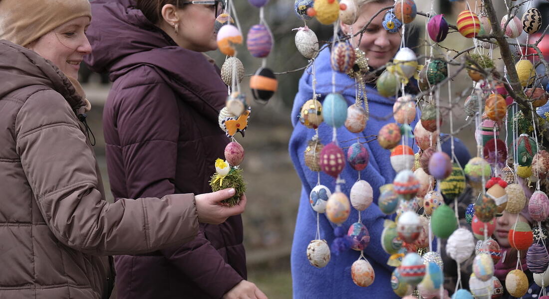 Multi-coloured Easter eggs hung on trees in Seduva © EPA