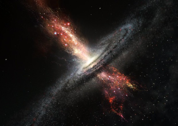 Rappresentazione artistica di una galassia e di un buco nero supermassiccio al cui interno stanno nascendo nuove stelle (fonte: ESO/M. Kornmesser) © Ansa