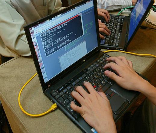 Hackers and counter-hackers compete during a computer security conference in Kuala Lumpur [ARCHIVE MATERIAL 20041006 ]