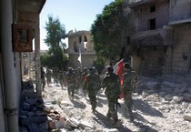 Soldati siriani ad Handarat in una foto fornita dall'agenzia Sana (ANSA)