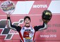 Lo spagnolo Marc Marquez esulta sul podio al Gp del Giappone di Montegi, per la vittoria e la conquista del mondiale © Ansa