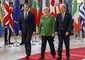 Emmanuel Macron, Angela Merkel e Paolo Gentiloni a Bruxelles © Ansa