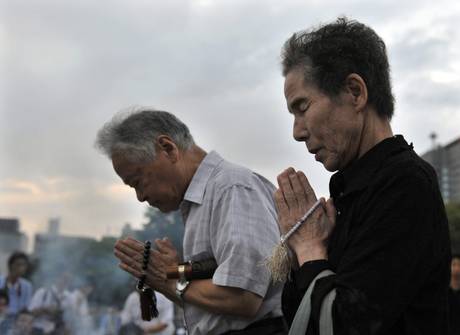 A-bomb survivors in Hiroshima offer a prayer for victims of the world's first atomic bombing