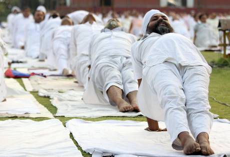 Indian people perform Yoga exercises as they take part in a Yoga camp organized by the Bhartiya Yog Sansthan, an Indian Yoga organization in Amritsar.