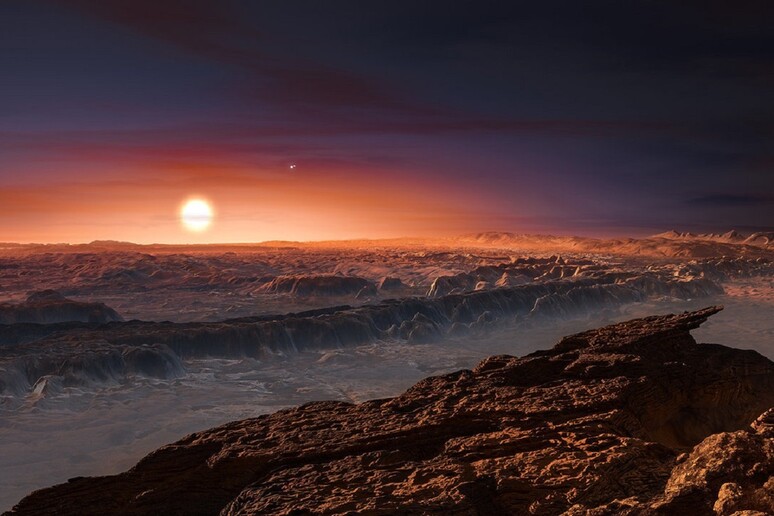 Rappresentazione artistica del pianeta Proxima b, in orbita intorno alla stella più vicina alla Terra, Proxima Centauri (fonte: ESO/M. Kornmesser) - RIPRODUZIONE RISERVATA