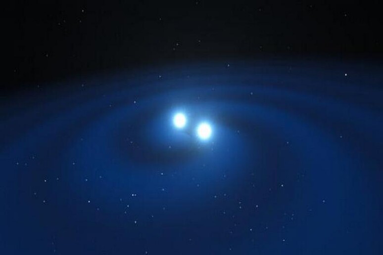 Onde gravitazionali generate dalla fusione di due stelle di neutroni (fonte: ESO/L. Calçada/M. Kornmesser) - RIPRODUZIONE RISERVATA