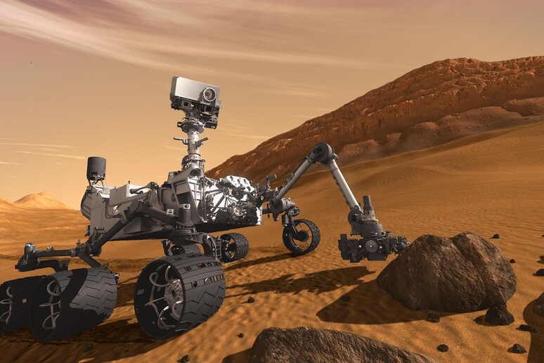 Rappresentazione artistica del robot laboratorio Curiosity sul suolo marziano (fonte: JPL/NASA) - RIPRODUZIONE RISERVATA