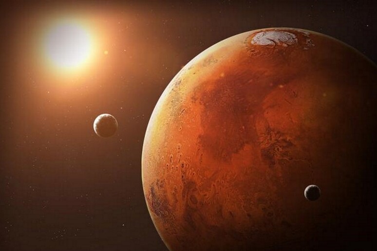 Rappresentazione artistica di Marte e delle sue due lune (fonte: YONHAP/EPA) - RIPRODUZIONE RISERVATA