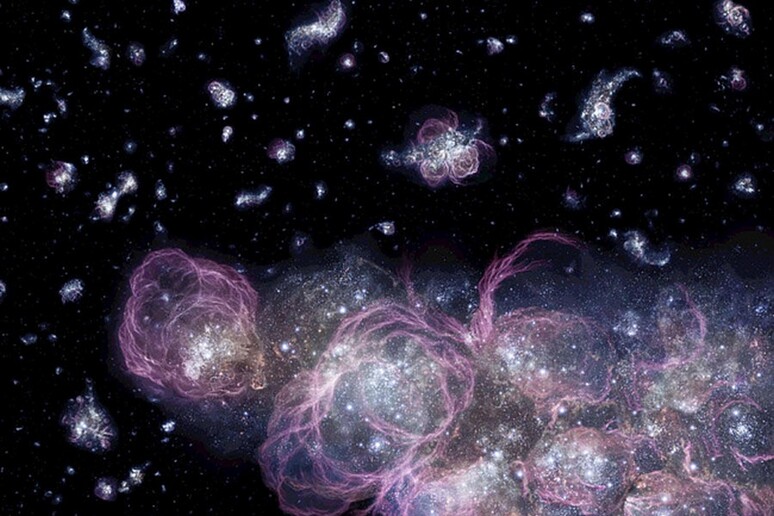 Rappresentazione artistica delle prime galassie, nate circa un miliardo di anni dopo il Big Bang (fonte: Adolf Schaller/NASA-MSFC) - RIPRODUZIONE RISERVATA