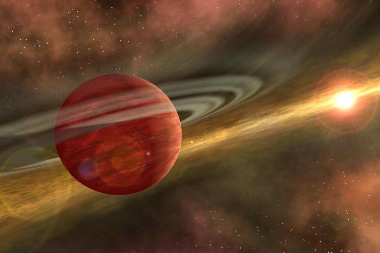 Una interpretazione artistica del momento in cui masse caotiche di gas e polveri cominciano ad aggregarsi per dare origine a un pianeta (fonte: NASA/JPL-Caltech) - RIPRODUZIONE RISERVATA