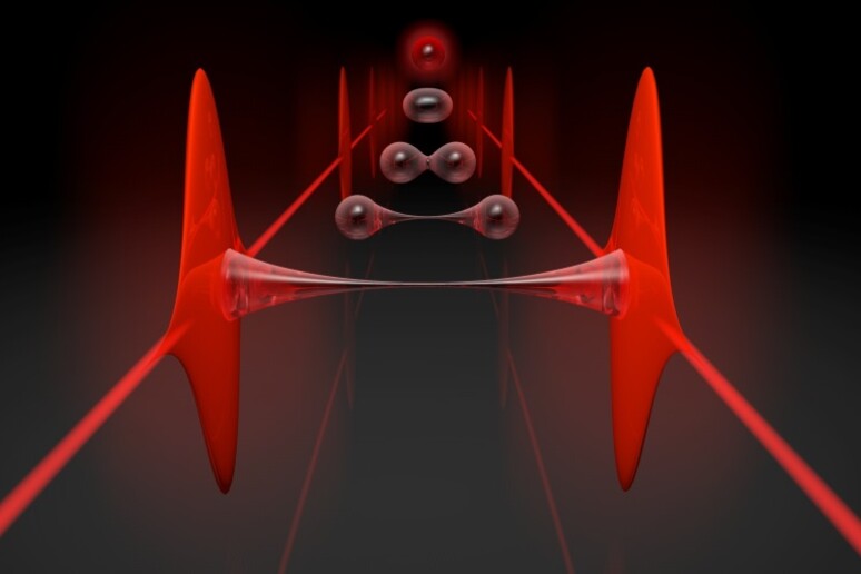 Rappresentazione grafica del modo in cui un’invisibile colla fatta di particelle di luce riesce a legare due fasci laser (fonte: INO-CNR) - RIPRODUZIONE RISERVATA