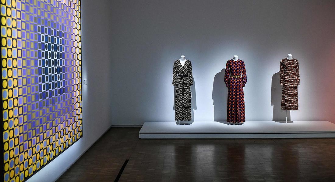 s a creation of late French designer Yves  Saint-Laurent displayed next an artwork entitled 'Alom' by Hungarian-French artist Victor Vasarely  at the Centre Pompidou (National Modern Art Museum) © AFP