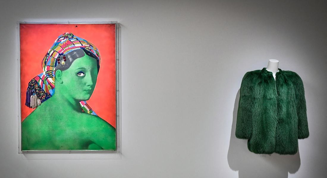a creation of late French designer Yves  Saint-Laurent displayed next a painting entitled 'Made in Japan - La Grande Odalisque' by artist  Martial Raysse at the Centre Pompidou (National Modern Art Museum) © AFP
