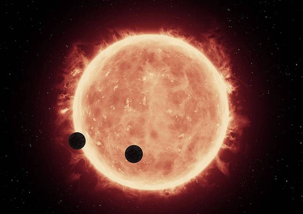 Rappresentazione artistica dei due pianeti rocciosi simili alla Terra, la cuia tmosfera è stata osservata grazie al telescopio spaziale Hubble (fonte: NASA/ESA/STScI/J. de Wit, MIT) © Ansa