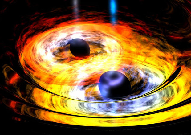 Rappresentazione artistica di una collisione di buchi neri (fonte: NASA) © Ansa