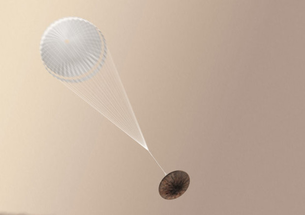 Una interpretazione artistica del lander Schiaparelli con il paracadute aperto (Fonte: ESA/ATG medialab) © Ansa
