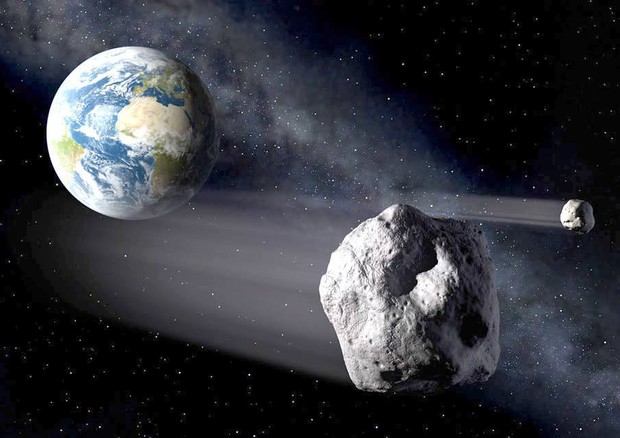 Rappresentazione artistica di asteroidi vicini alla Terra (fonte: ESA / P. Carril) © Ansa