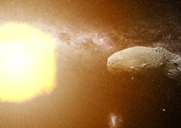 Rappresentazione artistica dell’asteroide Itokawa colpito dal vento solare (fonte: Curtin University) © Ansa