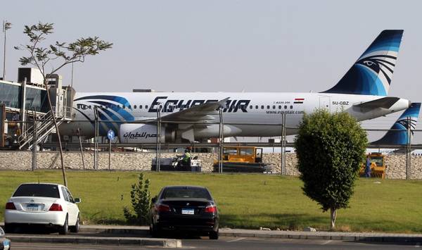 Planes of Egypt's state-owned carrier, EgyptAir, sit on a runway at Cairo Airport.