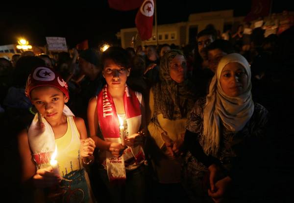 Several women took part in a demonstration in Tunis to commemorate the eight soldiers killed