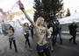 Le tre attiviste si sono denudate il seno mostrando una scritta a caratteri cubitali: Sos Davos