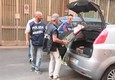La polizia scientifica nello stabile di via Curtatone, sequestrati pc e ricevute (ANSA)