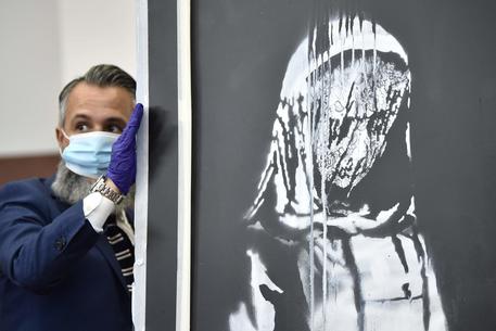 Il Banksy rubato al Bataclan © AFP