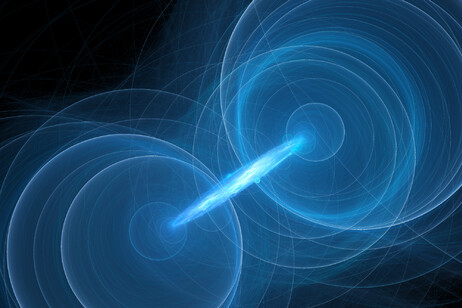 Rappresentazione artistica della correlazione quantistica fra due fotoni (fotoni: :sakkmesterke, da iStock)