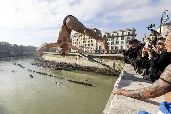 New Year traditional dive in the river Tevere, Rome