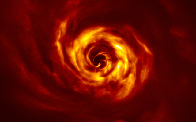Il disco che circonda la giovane stella AB Aurigae star, wfotografato dal Very Large Telescope (VLT) dell'Eso. In giallo le zone in cui avviene la formazione dei pianeti (fonte: ESO/Boccaletti et al.)