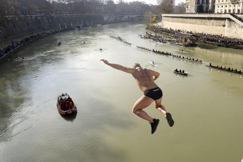 New Year traditional dive in the river Tevere, Rome - ALL RIGHTS RESERVED