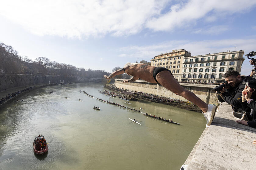 New Year traditional dive in the river Tevere, Rome - ALL RIGHTS RESERVED