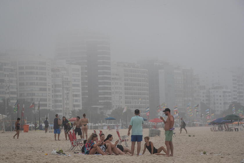 Dense fog covers Copacabana Beach in Rio on last summer day in Brazil