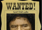 Il poster da film western con la scritta Wanted e con sotto la faccia di Gheddafi e il reward, la taglia da 1,7 milioni di dollari posta dal Consiglio nazionale transitorio © Ansa