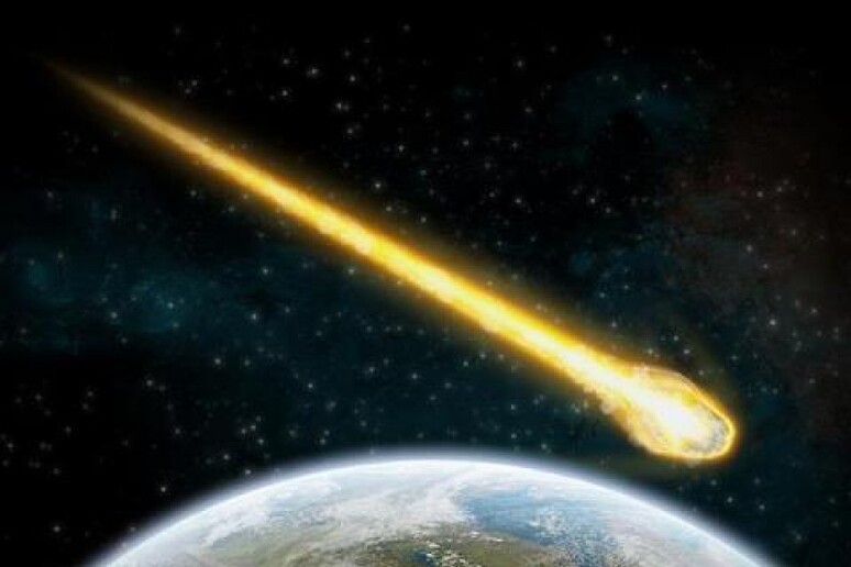Rappresentazione artistica del passaggio di un asteroide vicino alla Terra - RIPRODUZIONE RISERVATA