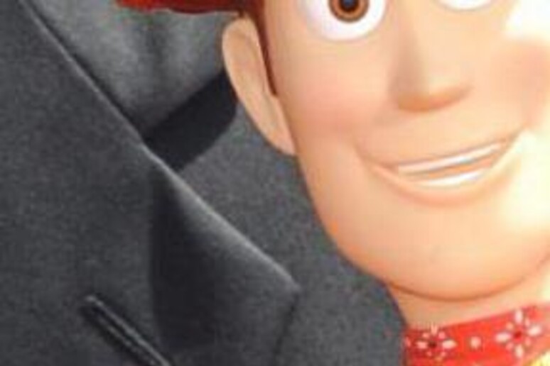 John Lasseter con i personaggi-giocattolo di Toy Story - RIPRODUZIONE RISERVATA