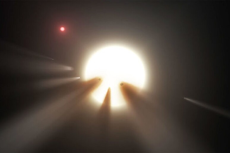 Rappresentazione artistica della stella KIC 8462852, circondata da comete e dalle loro polveri (fonte: JPL-Caltech/NASA) - RIPRODUZIONE RISERVATA