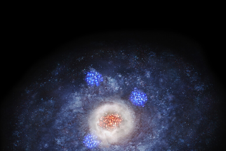 Rappresentazione artistica di una galassia che comincia a modificare la sua forma sotto la spinta delle riserve di gas e polveri che daranno origine alle nuove stelle (fonte: NAOJ) - RIPRODUZIONE RISERVATA